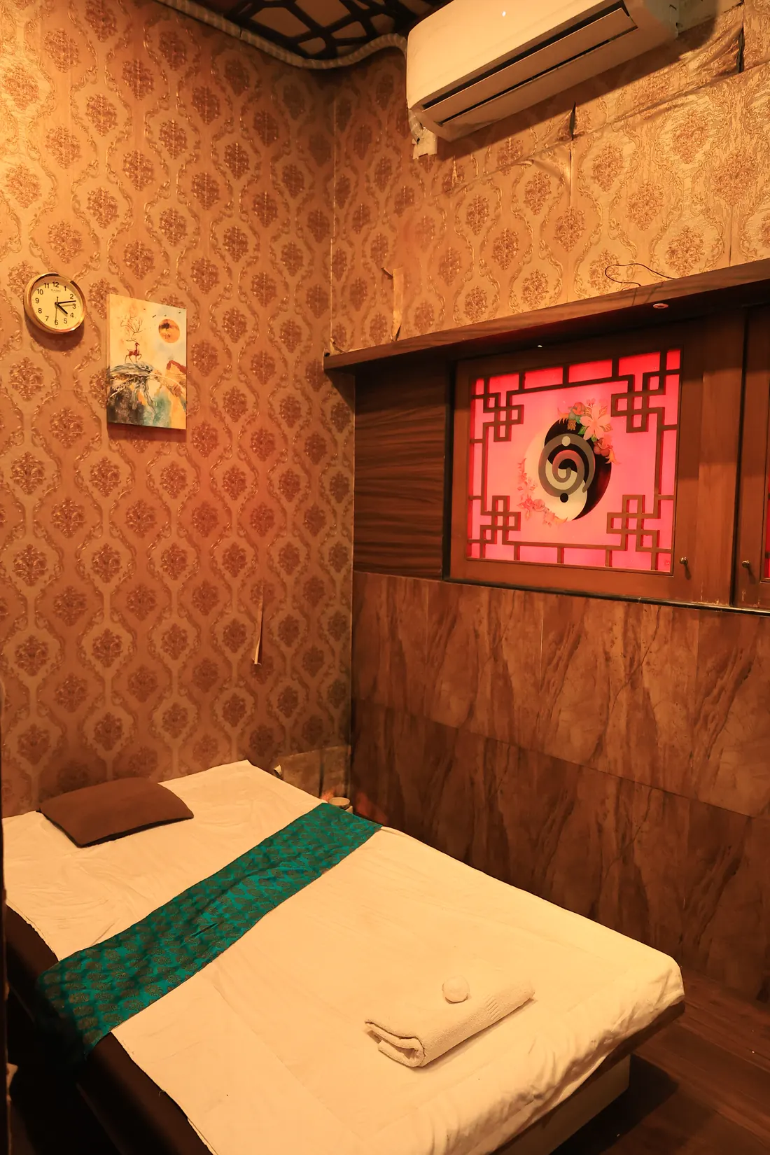 Warm-toned massage cabin with air conditioning at Deep Spa